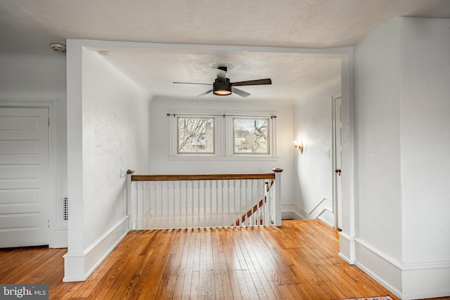 interior space featuring hardwood / wood-style flooring and ceiling fan