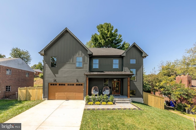 view of front of house featuring fence, board and batten siding, and a front yard