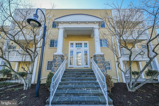 property entrance featuring brick siding