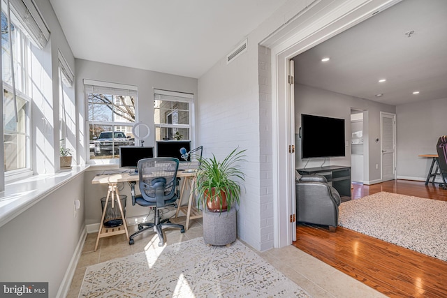 office with baseboards, visible vents, wood finished floors, and recessed lighting