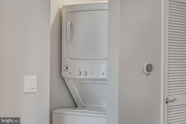 laundry area featuring laundry area and stacked washer / drying machine