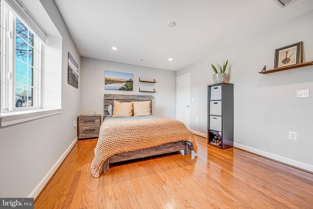 bedroom featuring recessed lighting, light wood-type flooring, and baseboards