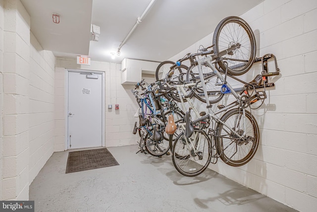 garage with concrete block wall and bike storage