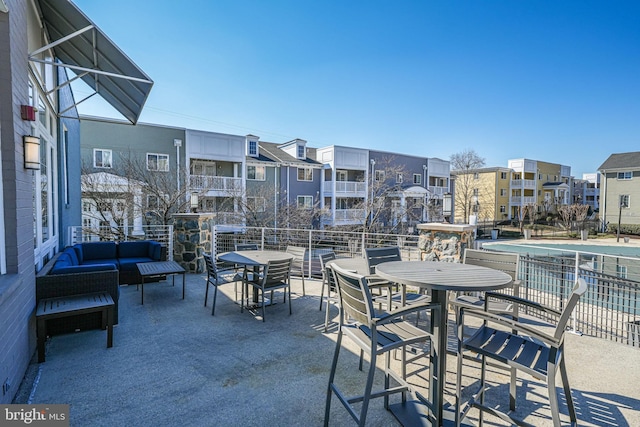 view of patio with a residential view and an outdoor living space