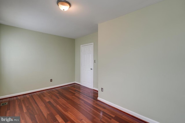 empty room featuring dark hardwood / wood-style floors