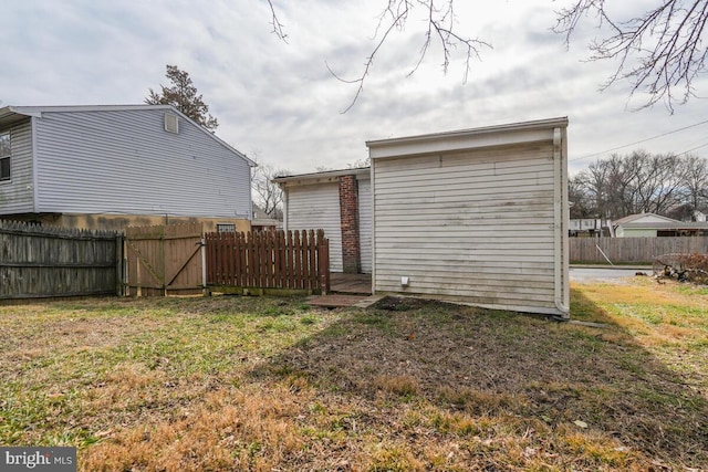 rear view of property featuring a yard