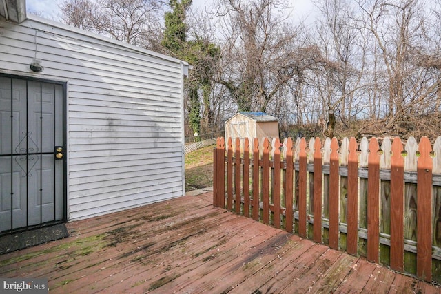 wooden terrace with a storage unit