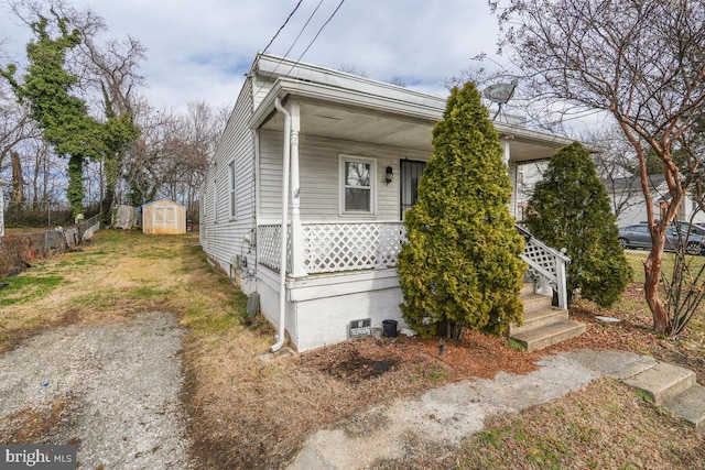 view of front of house with a shed