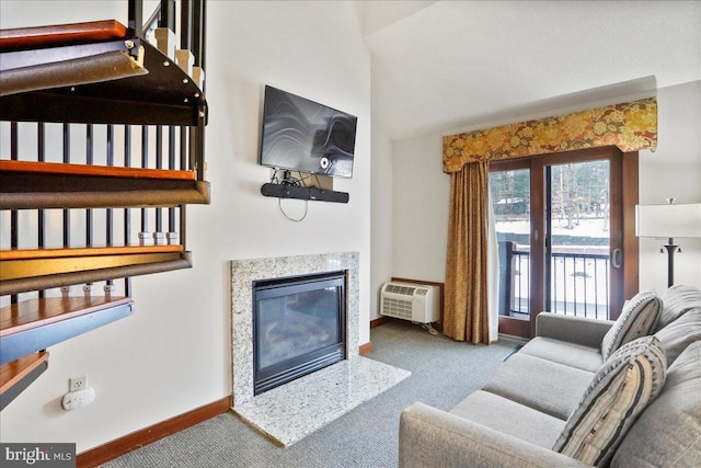 living room with carpet flooring and a wall mounted AC