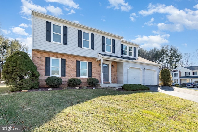 view of property with a front lawn and a garage