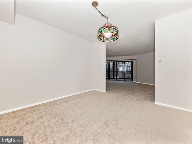 empty room featuring carpet floors