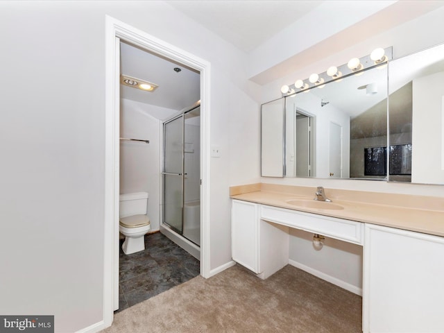 bathroom featuring vanity, an enclosed shower, and toilet