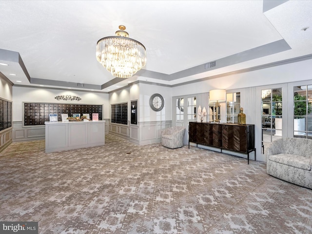 welcome area featuring an inviting chandelier and french doors