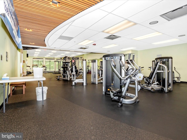 workout area with a paneled ceiling