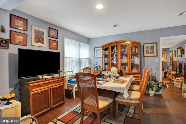 dining room featuring dark wood-type flooring and recessed lighting