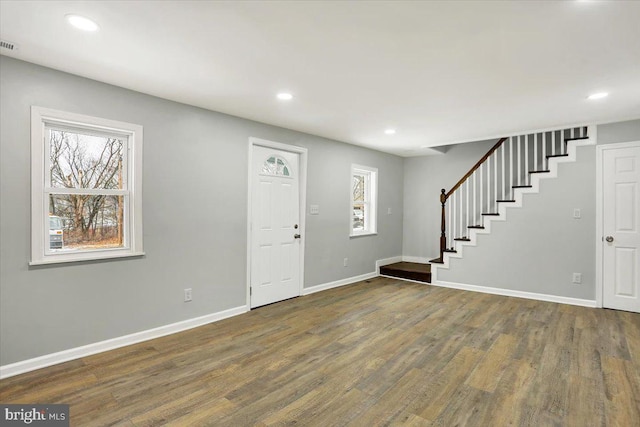 foyer entrance featuring dark hardwood / wood-style floors