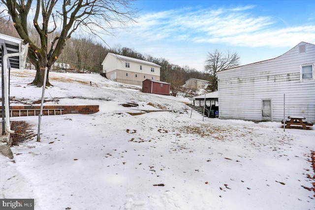 view of yard covered in snow