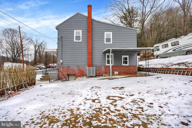 view of snow covered house