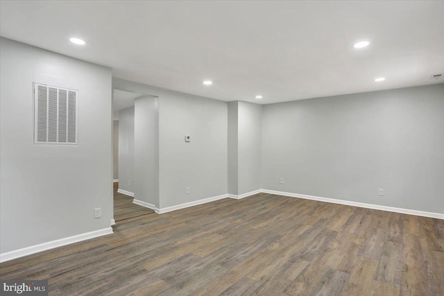 basement with dark wood-type flooring