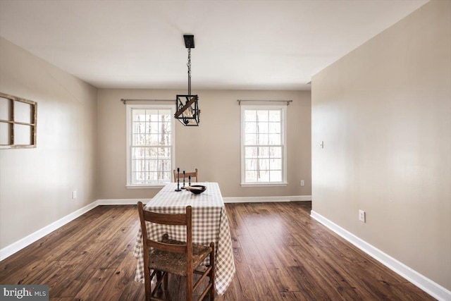 unfurnished dining area featuring dark hardwood / wood-style flooring