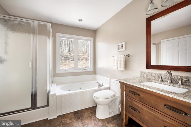 full bathroom with vanity, independent shower and bath, and toilet