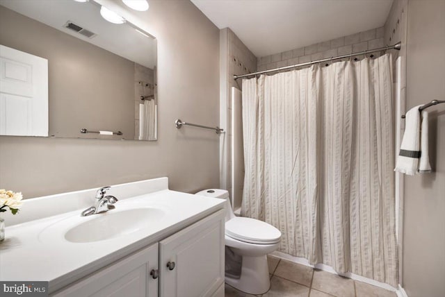 bathroom with vanity, a shower with curtain, tile patterned floors, and toilet