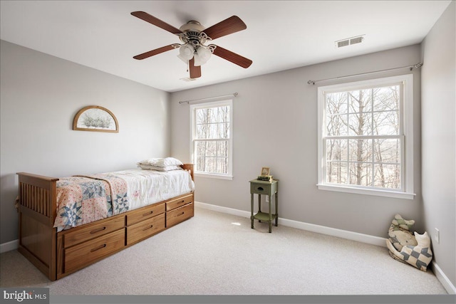 bedroom featuring ceiling fan and light colored carpet