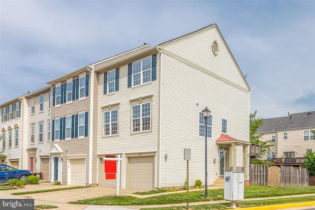 view of front facade featuring a garage and a front lawn