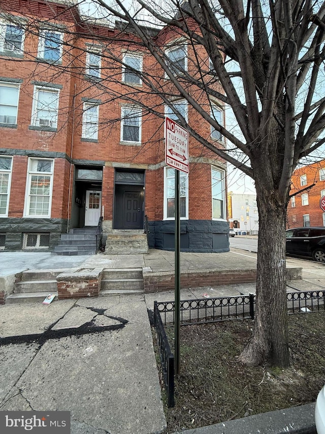 view of front of property featuring brick siding