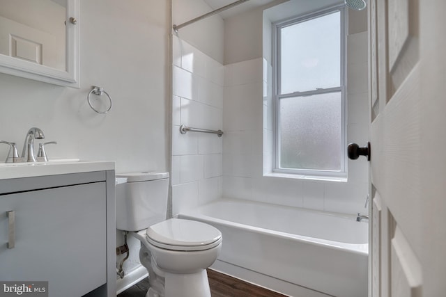 full bathroom featuring toilet, shower / tub combination, a wealth of natural light, and vanity