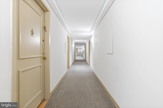 corridor featuring light carpet