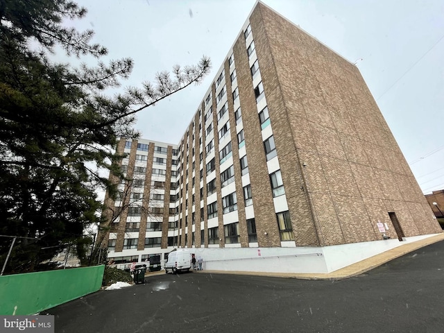 view of building exterior with fence