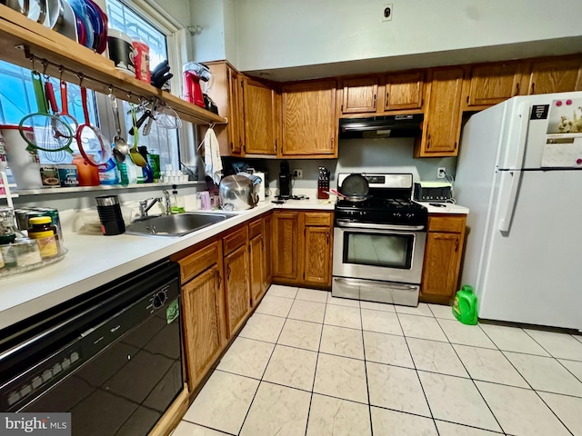 kitchen with sink, dishwasher, range hood, stainless steel gas range oven, and white fridge