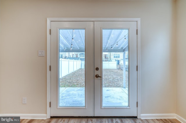 doorway featuring light hardwood / wood-style flooring and french doors