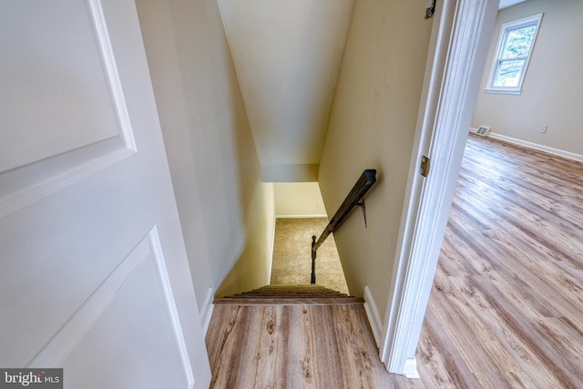 stairway with wood-type flooring