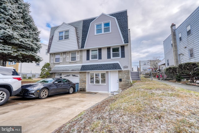 multi unit property featuring a garage