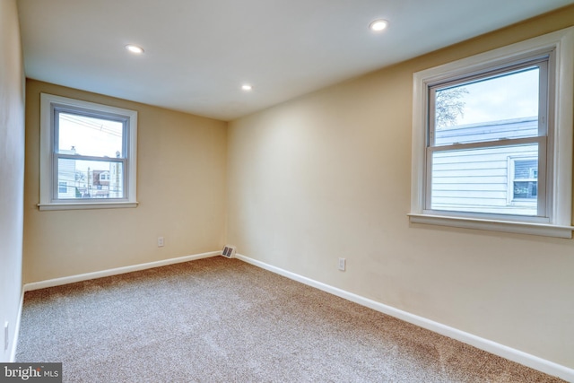 unfurnished room featuring carpet flooring