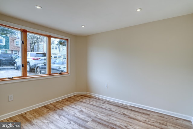 unfurnished room featuring light wood-type flooring