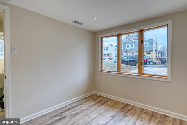 empty room with light hardwood / wood-style floors