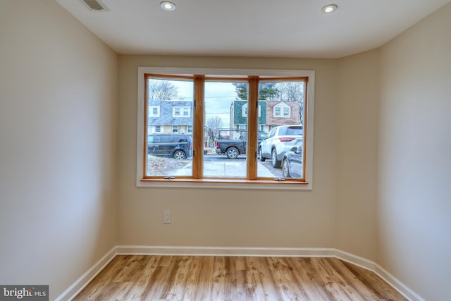 spare room featuring light wood-type flooring