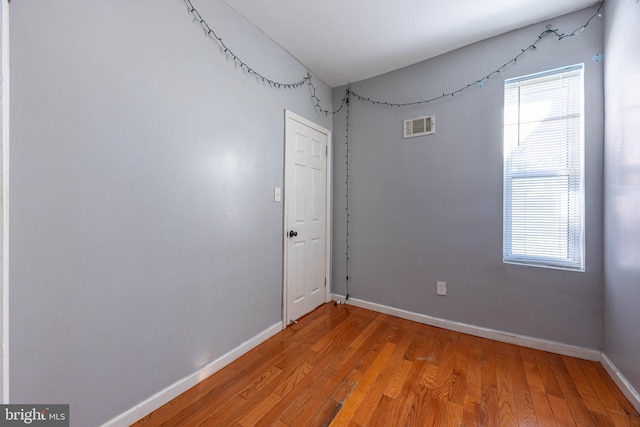 empty room featuring hardwood / wood-style flooring