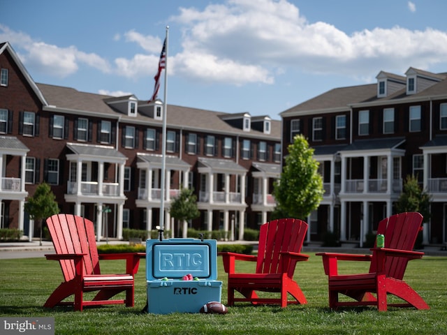 view of property's community with a lawn