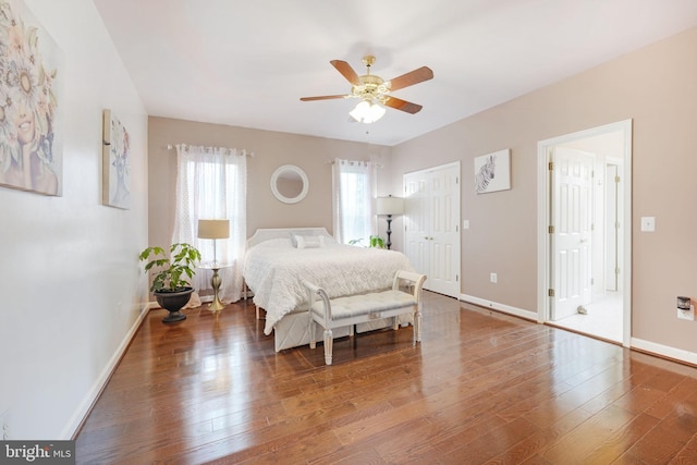 bedroom featuring hardwood / wood-style flooring and baseboards