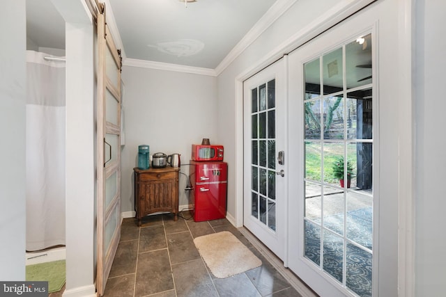 doorway to outside with baseboards, french doors, a barn door, and crown molding