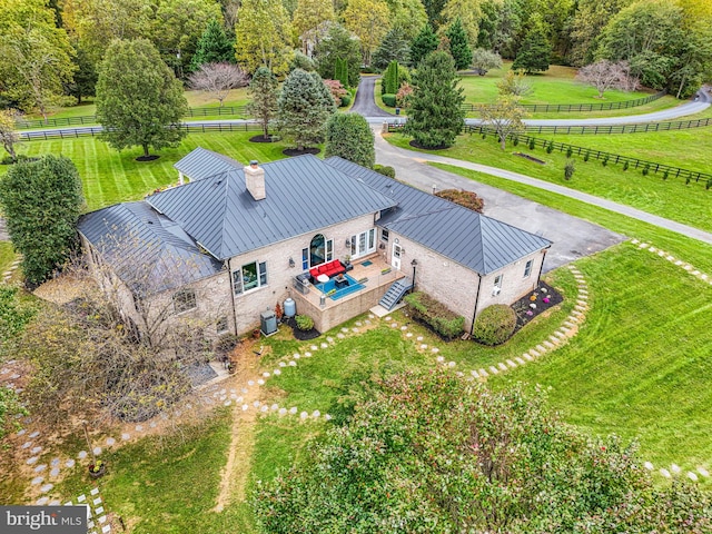 birds eye view of property featuring a rural view