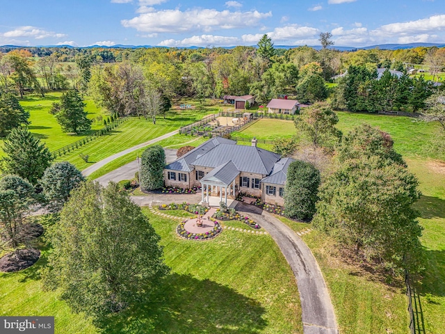 bird's eye view featuring a wooded view