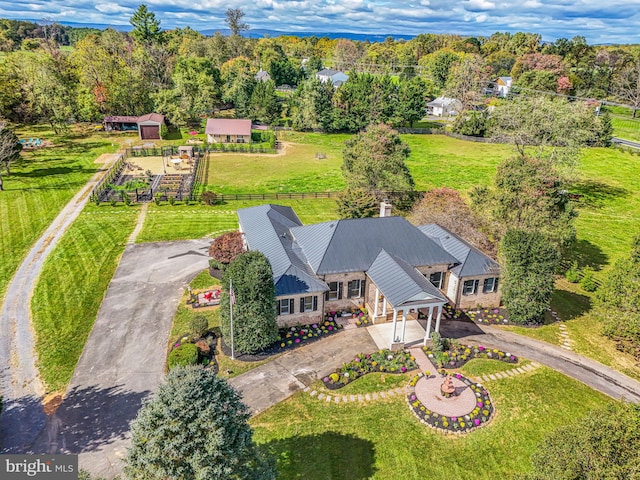 bird's eye view featuring a forest view