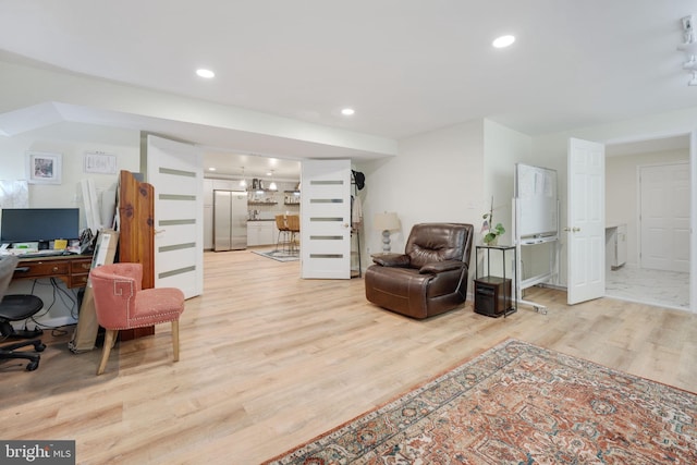 sitting room with recessed lighting and wood finished floors