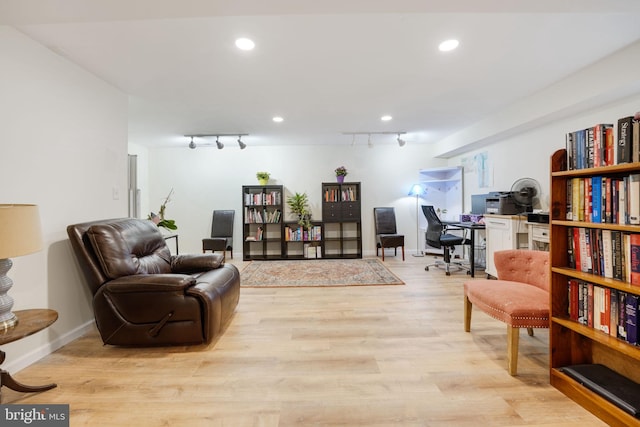 living area with recessed lighting, baseboards, light wood-style flooring, and track lighting