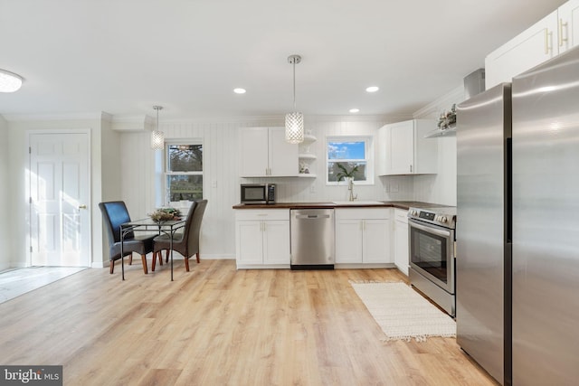 kitchen featuring open shelves, appliances with stainless steel finishes, white cabinetry, a sink, and light wood-type flooring